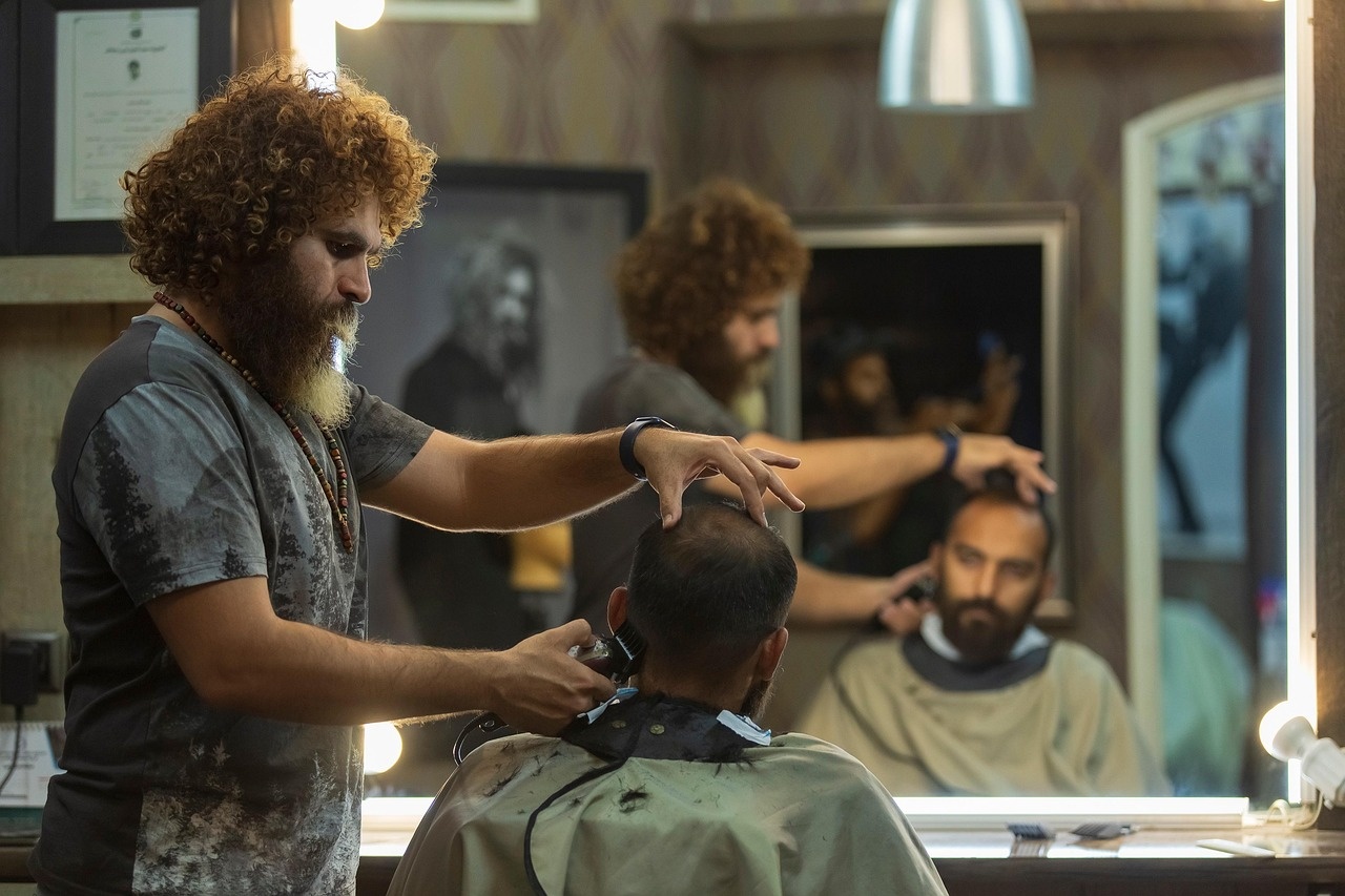 Barber consulting with a client before a precision haircut