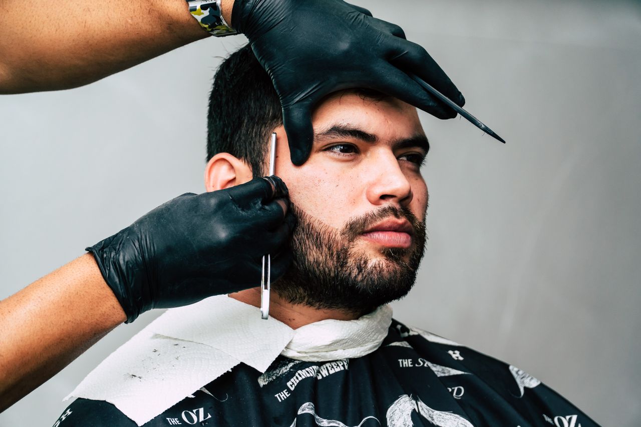 Detailed barber craftsmanship during a scissor haircut