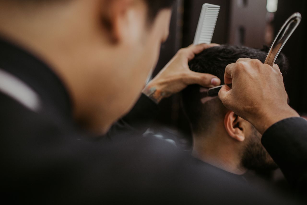 Close detail of scissor-over-comb cutting technique