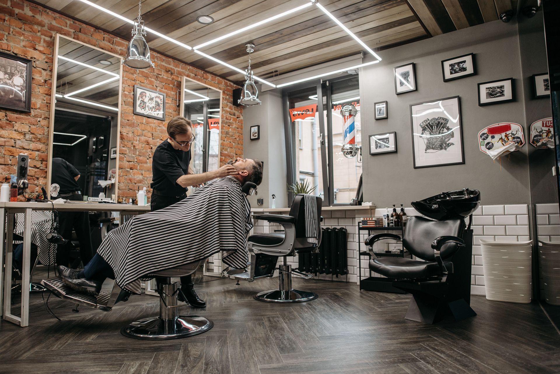 Galpero barbershop interior with barber grooming a client in West Melbourne